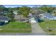 Single-Gathering home with a large yard and driveway, near palm trees at 772 Horseman Dr, Port Orange, FL 32127