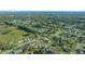 Aerial view showing a neighborhood with houses and green spaces at 772 Horseman Dr, Port Orange, FL 32127
