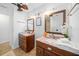 Double vanity bathroom with marble countertops and updated fixtures at 772 Horseman Dr, Port Orange, FL 32127