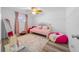 Bright bedroom with pink accents and built in shelving at 772 Horseman Dr, Port Orange, FL 32127