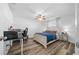 Spacious bedroom with wood-look flooring and built-in workspace at 772 Horseman Dr, Port Orange, FL 32127