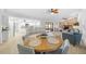 Open concept dining room with a wooden table and kitchen view at 772 Horseman Dr, Port Orange, FL 32127