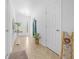 Clean hallway with tile flooring and a decorative ladder at 772 Horseman Dr, Port Orange, FL 32127