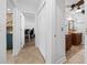 Clean hallway with tile flooring and access to several rooms at 772 Horseman Dr, Port Orange, FL 32127
