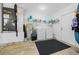 Convenient laundry room with washer, dryer, and extra storage at 772 Horseman Dr, Port Orange, FL 32127