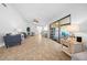 Open living room with tile floors and view into the screened patio at 772 Horseman Dr, Port Orange, FL 32127