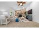 Living room with stone fireplace and built-in entertainment center at 772 Horseman Dr, Port Orange, FL 32127