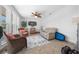 Relaxing living room with wicker chairs and a large TV at 772 Horseman Dr, Port Orange, FL 32127