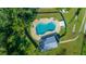 An aerial view of a kidney-shaped community pool at 772 Horseman Dr, Port Orange, FL 32127