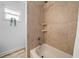 Clean shower with neutral tile and a built-in shelf at 772 Horseman Dr, Port Orange, FL 32127