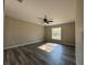 Spacious bedroom with ceiling fan and large window at 78 Pine Radl, Ocala, FL 34472