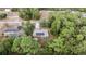 Aerial view of a house with solar panels and a garden at 8465 Sw 202Nd Ter, Dunnellon, FL 34431