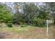 Landscaped backyard with lush greenery and garden at 8465 Sw 202Nd Ter, Dunnellon, FL 34431