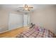 Bright bedroom with a double bed and built-in closet at 8465 Sw 202Nd Ter, Dunnellon, FL 34431
