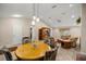 Dining area with a round wooden table and floral patterned chairs at 8465 Sw 202Nd Ter, Dunnellon, FL 34431