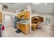 Kitchen with wood cabinets, granite countertops, and access to the living area at 8465 Sw 202Nd Ter, Dunnellon, FL 34431
