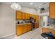 Kitchen with wood cabinets, granite countertops, and stainless steel appliances at 8465 Sw 202Nd Ter, Dunnellon, FL 34431
