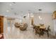 Spacious living room and dining area with tile floors and neutral decor at 8465 Sw 202Nd Ter, Dunnellon, FL 34431