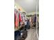 Large walk-in closet with shelving and hanging rods at 8465 Sw 202Nd Ter, Dunnellon, FL 34431