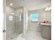 Bathroom with a walk-in shower, double vanity, and modern fixtures at 9125 Se 47 Court Rd, Ocala, FL 34480