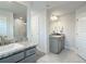 Modern bathroom with double vanity and a large mirror at 9125 Se 47 Court Rd, Ocala, FL 34480