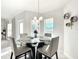Casual dining area with glass table and four gray chairs at 9125 Se 47 Court Rd, Ocala, FL 34480