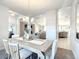 Open concept dining room, showcasing views of the living room and kitchen at 9125 Se 47 Court Rd, Ocala, FL 34480