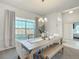 Bright dining room with farmhouse table and bench seating, near the kitchen at 9125 Se 47 Court Rd, Ocala, FL 34480