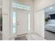 Bright entryway with tile floors and bedroom view at 9125 Se 47 Court Rd, Ocala, FL 34480