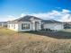 Single-story home with gray roof and landscaping at 9125 Se 47 Court Rd, Ocala, FL 34480
