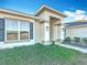 House exterior with gray siding and shutters at 9125 Se 47 Court Rd, Ocala, FL 34480