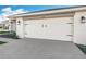 White garage door with black accents at 9125 Se 47 Court Rd, Ocala, FL 34480