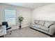 Spacious home office with a couch and window at 9125 Se 47 Court Rd, Ocala, FL 34480