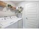 Laundry room featuring washer, dryer, and stylish storage at 9125 Se 47 Court Rd, Ocala, FL 34480