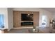 Living room with a modern TV wall and fireplace, offering an open layout at 9125 Se 47 Court Rd, Ocala, FL 34480