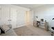 Home office with a couch, console table and adjacent bedroom at 9125 Se 47 Court Rd, Ocala, FL 34480