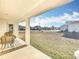 Covered patio provides relaxing seating and backyard views at 9125 Se 47 Court Rd, Ocala, FL 34480