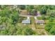 An aerial view showcasing the property's location in a lush, green neighborhood at 963 Nw 65Th St, Ocala, FL 34475