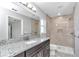Bathroom with granite countertop and walk-in shower at 963 Nw 65Th St, Ocala, FL 34475