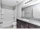 Modern bathroom with a shower/tub combo and granite vanity at 963 Nw 65Th St, Ocala, FL 34475