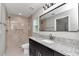Elegant bathroom featuring a granite vanity, sleek fixtures, and a tiled shower at 963 Nw 65Th St, Ocala, FL 34475