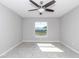 Bright bedroom with ceiling fan and large window at 963 Nw 65Th St, Ocala, FL 34475