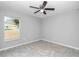 Spacious bedroom with tile floors and a ceiling fan at 963 Nw 65Th St, Ocala, FL 34475