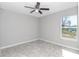 Well-lit bedroom with tile floor and ceiling fan at 963 Nw 65Th St, Ocala, FL 34475