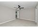 Spacious bedroom featuring neutral paint, ceiling fan, and tile flooring throughout at 963 Nw 65Th St, Ocala, FL 34475