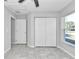 Bedroom with large closet and tile floors at 963 Nw 65Th St, Ocala, FL 34475