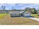 Newly constructed home with gray siding, gray roof, and a paved driveway at 963 Nw 65Th St, Ocala, FL 34475