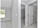 Clean hallway with tile floors and doors to bedrooms and bathroom at 963 Nw 65Th St, Ocala, FL 34475