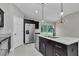 Modern kitchen with stainless steel appliances, a kitchen island and a view to the back yard at 963 Nw 65Th St, Ocala, FL 34475
