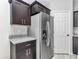 Stainless steel appliances and dark wood cabinets in this stylish kitchen at 963 Nw 65Th St, Ocala, FL 34475